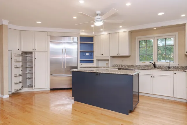 a bathroom with a sink a toilet and window