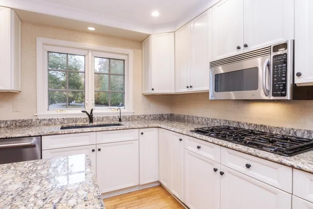 a room with pool tables and windows