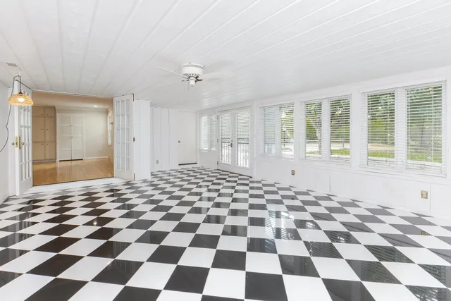 a view of staircase with white walls and stairs