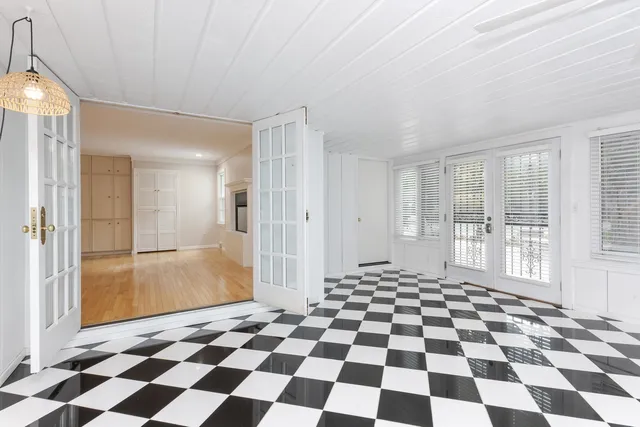 a white toilet sitting next to a bathroom sink