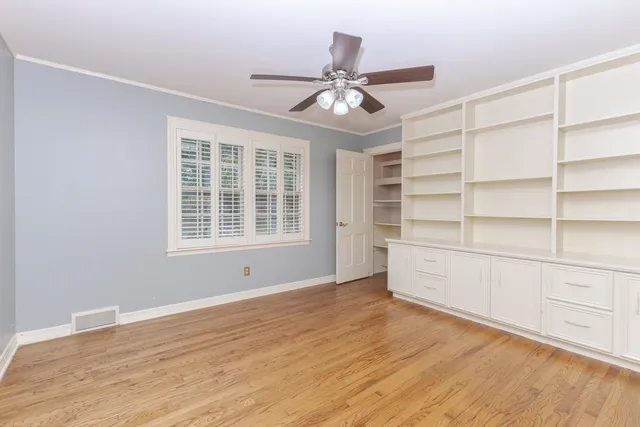a front view of a house with a plants