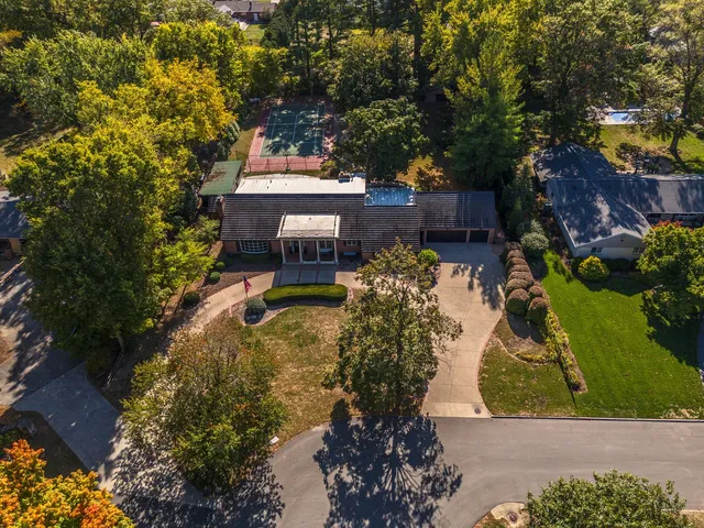 a view of a house with backyard porch and sitting area