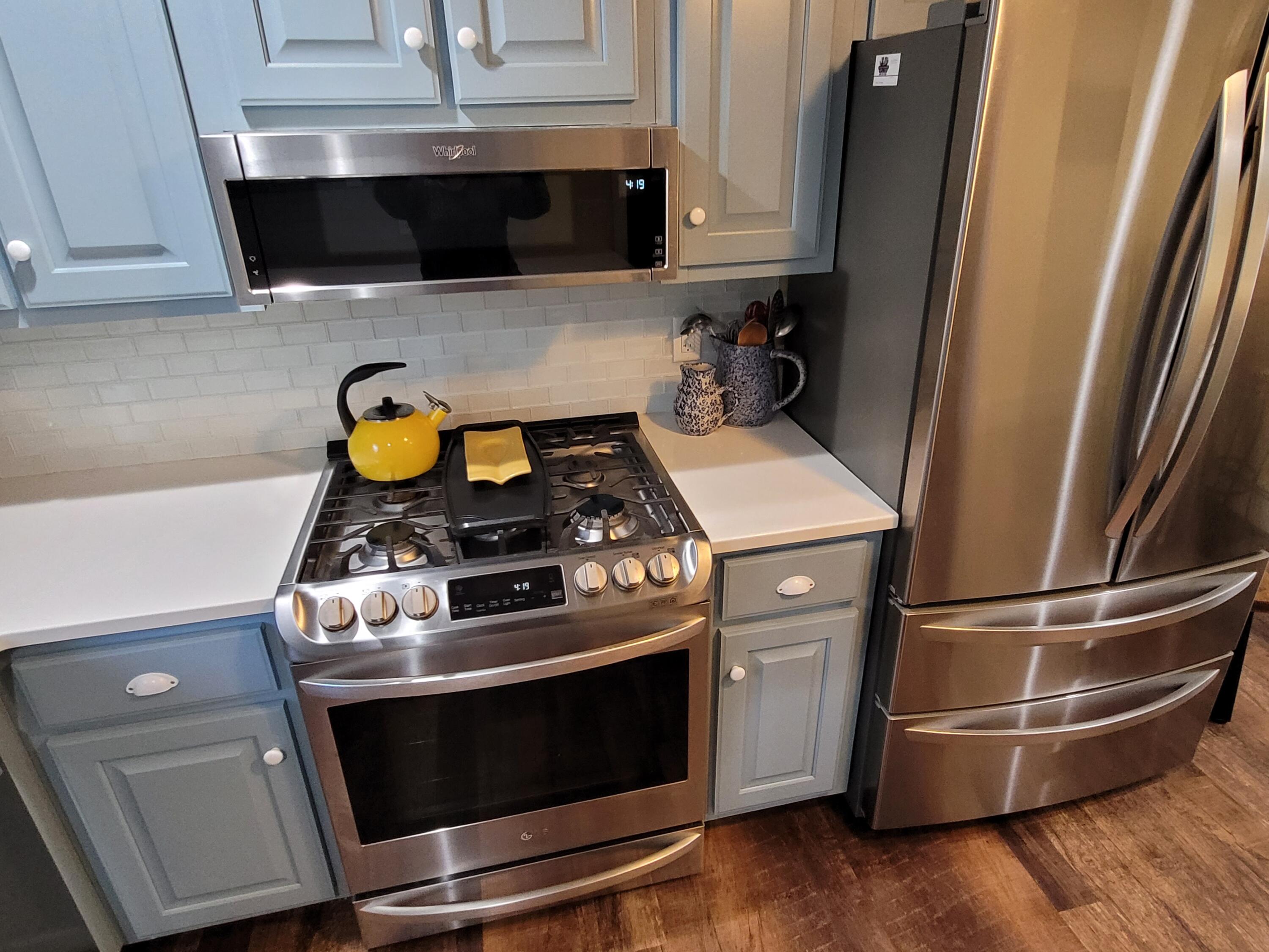 70 Trowbridge Path West Yarmouth, MA 02673 - Photo 11 of 69 a stove top oven sitting inside of a kitchen