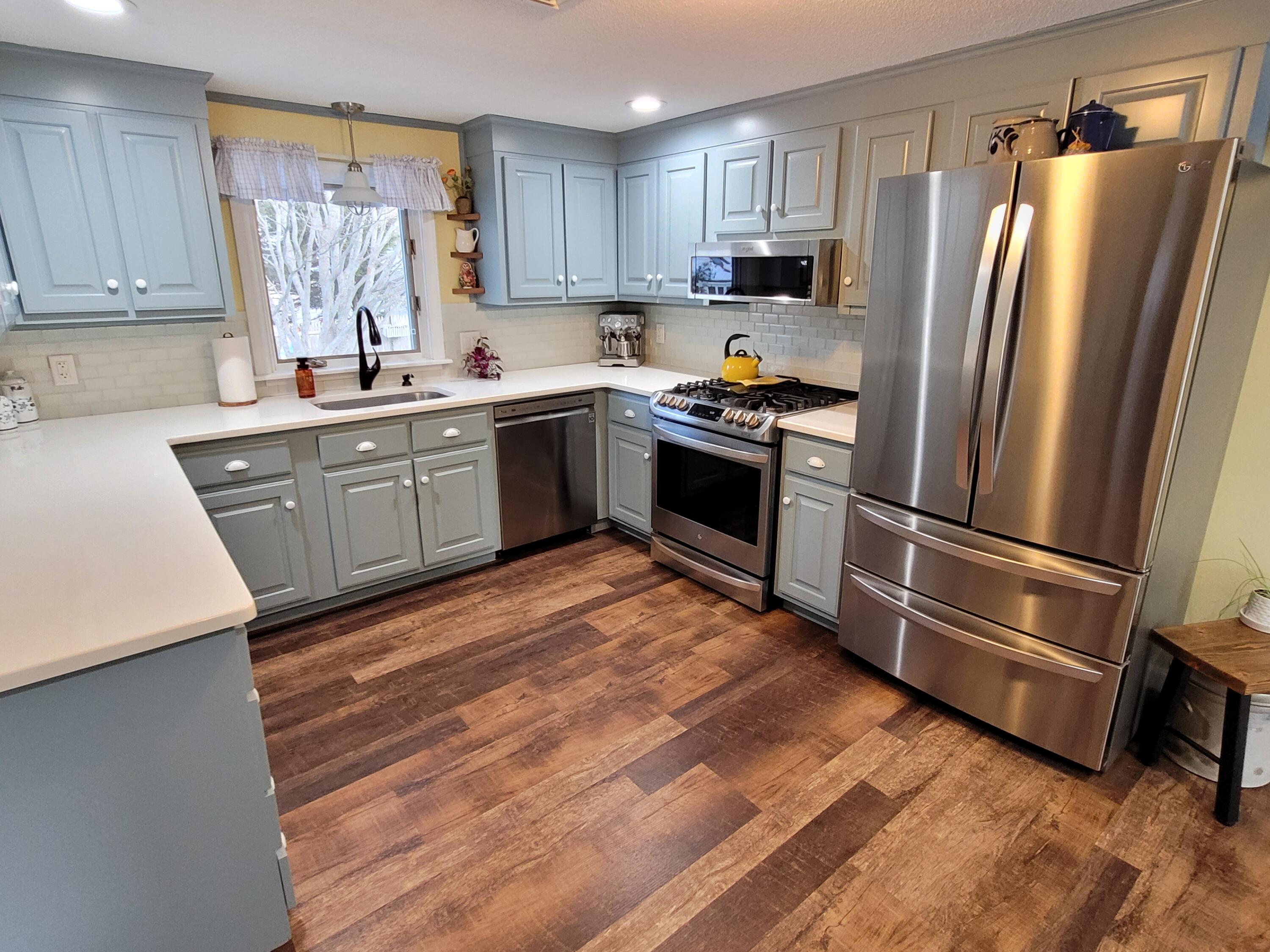 70 Trowbridge Path West Yarmouth, MA 02673 - Photo 16 of 69 a kitchen with a refrigerator stove and sink
