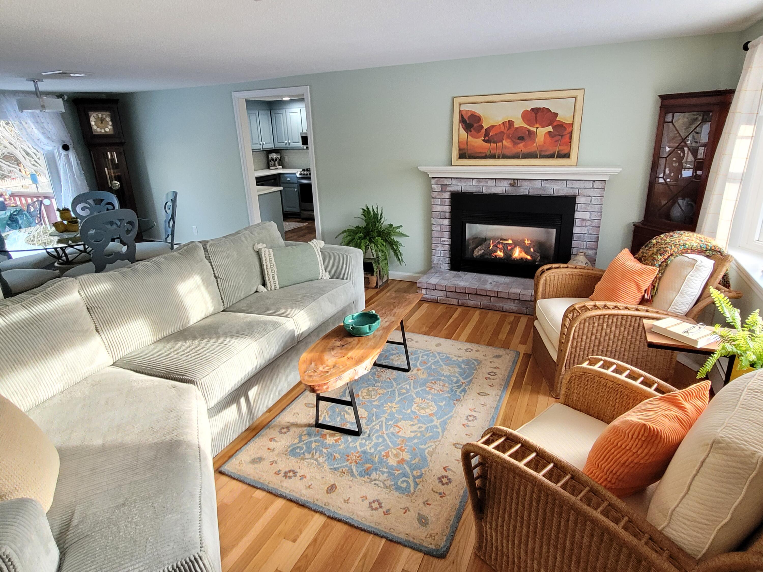 70 Trowbridge Path West Yarmouth, MA 02673 - Photo 18 of 69 a living room with furniture a flat screen tv and a fireplace