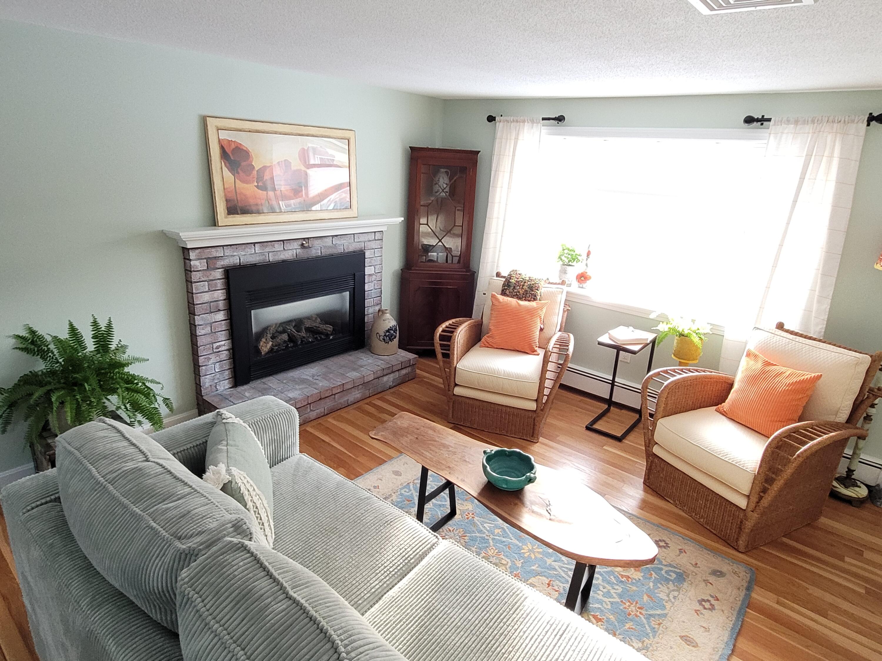 70 Trowbridge Path West Yarmouth, MA 02673 - Photo 19 of 69 a living room with furniture and a fireplace