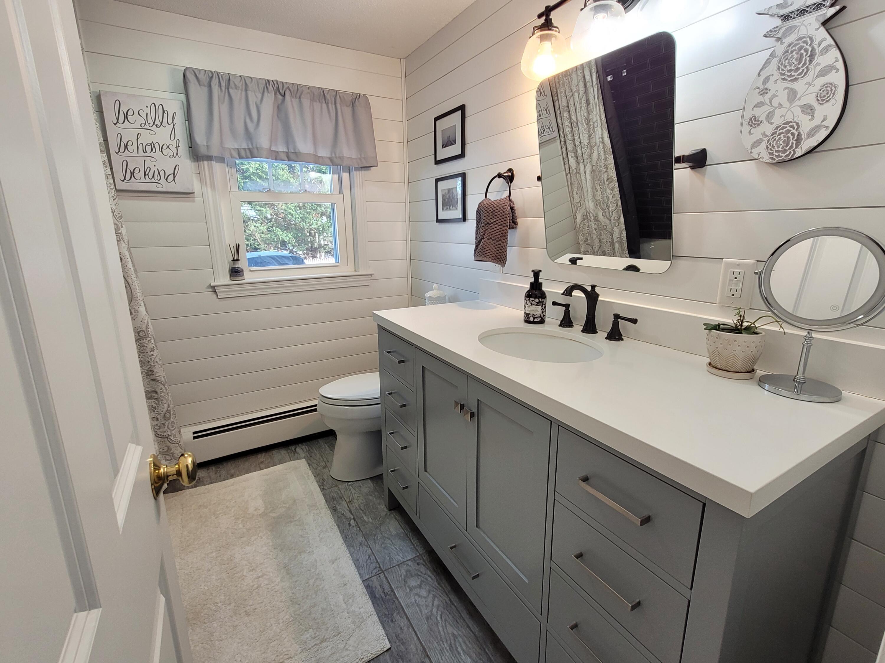 70 Trowbridge Path West Yarmouth, MA 02673 - Photo 24 of 69 a bathroom with a double vanity sink toilet and a mirror