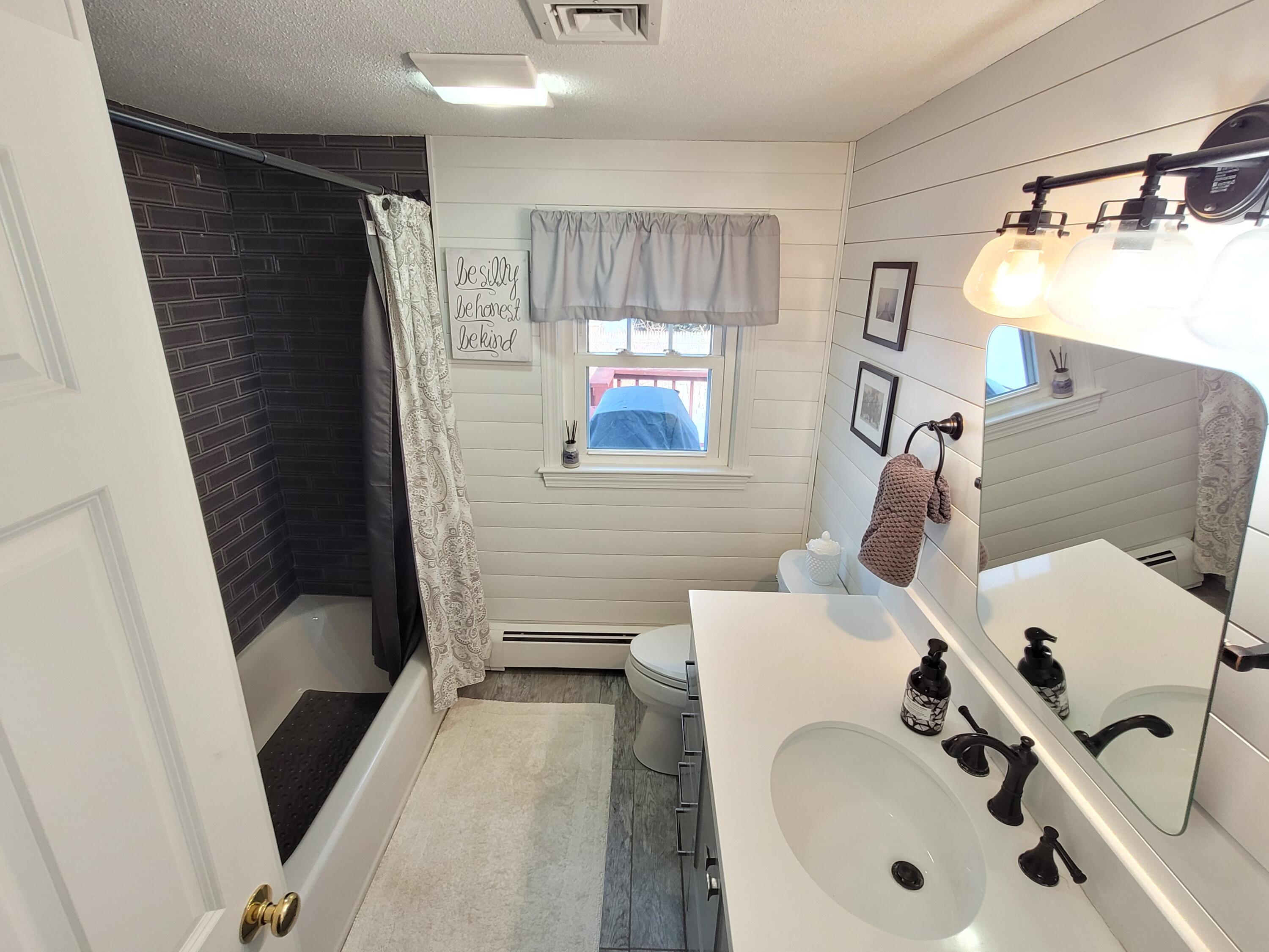 70 Trowbridge Path West Yarmouth, MA 02673 - Photo 25 of 69 a bathroom with a sink and a tub