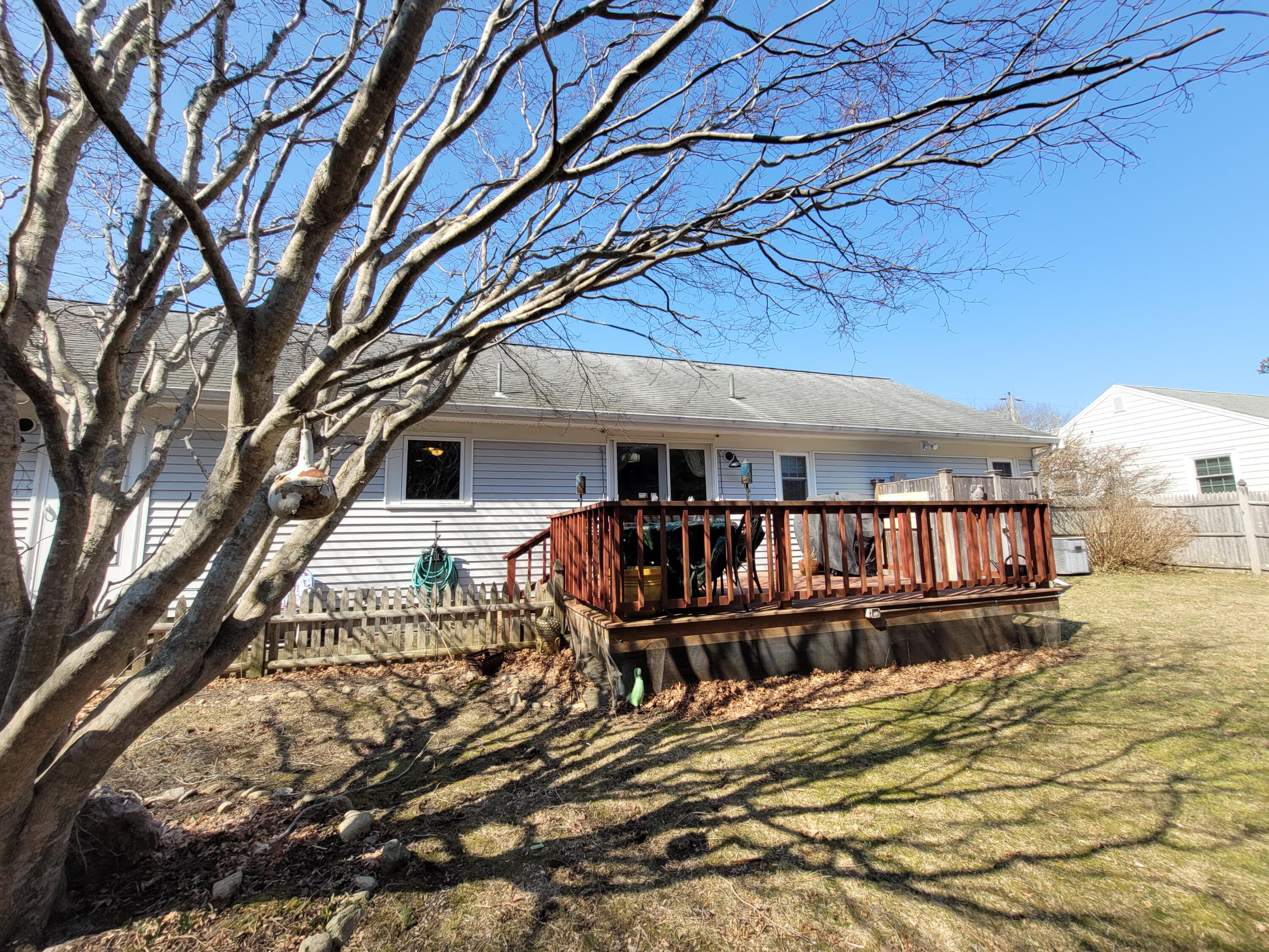 70 Trowbridge Path West Yarmouth, MA 02673 - Photo 52 of 69 a view of a house with wooden deck