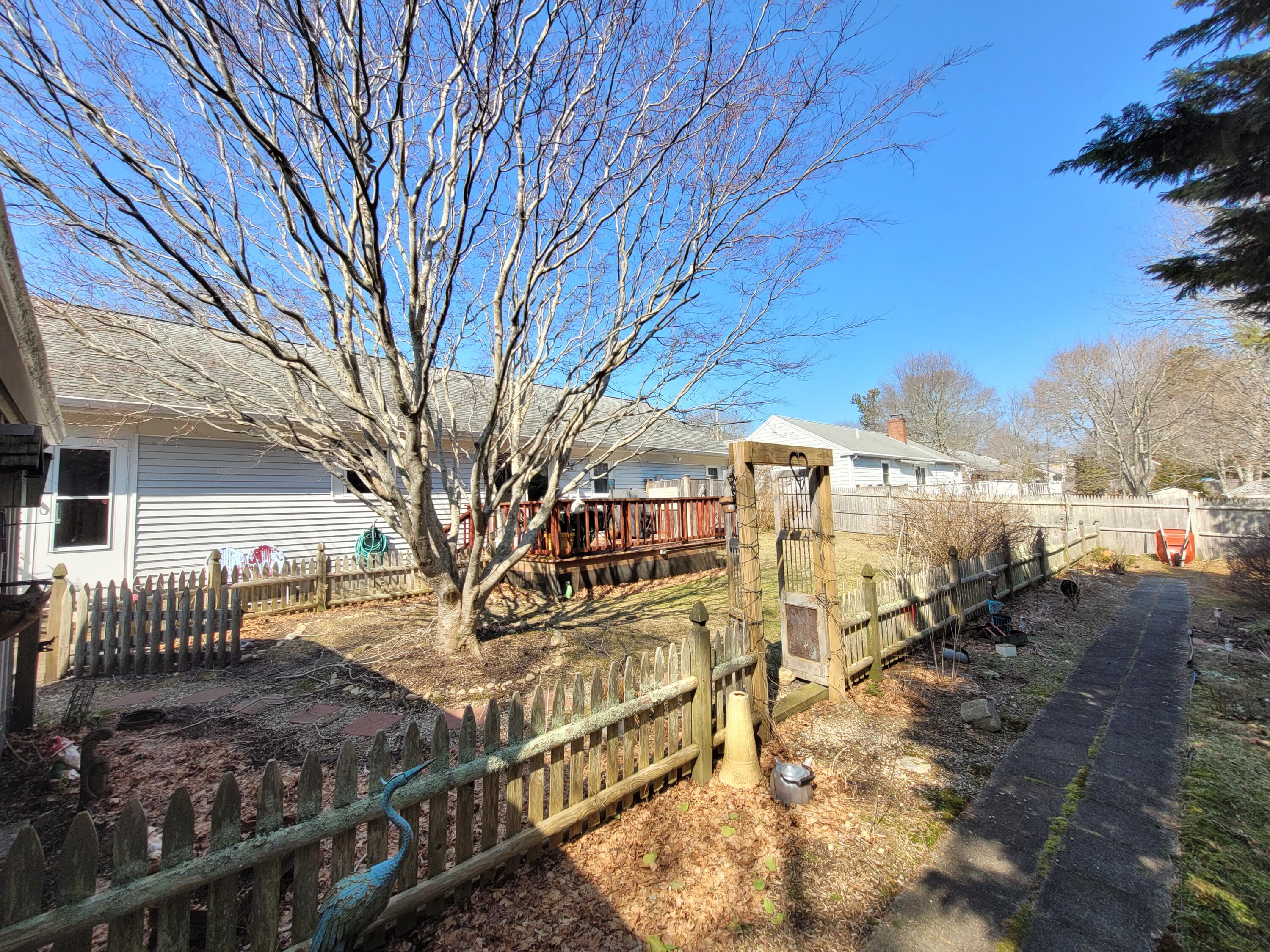 70 Trowbridge Path West Yarmouth, MA 02673 - Photo 53 of 69 a view of a house with a yard
