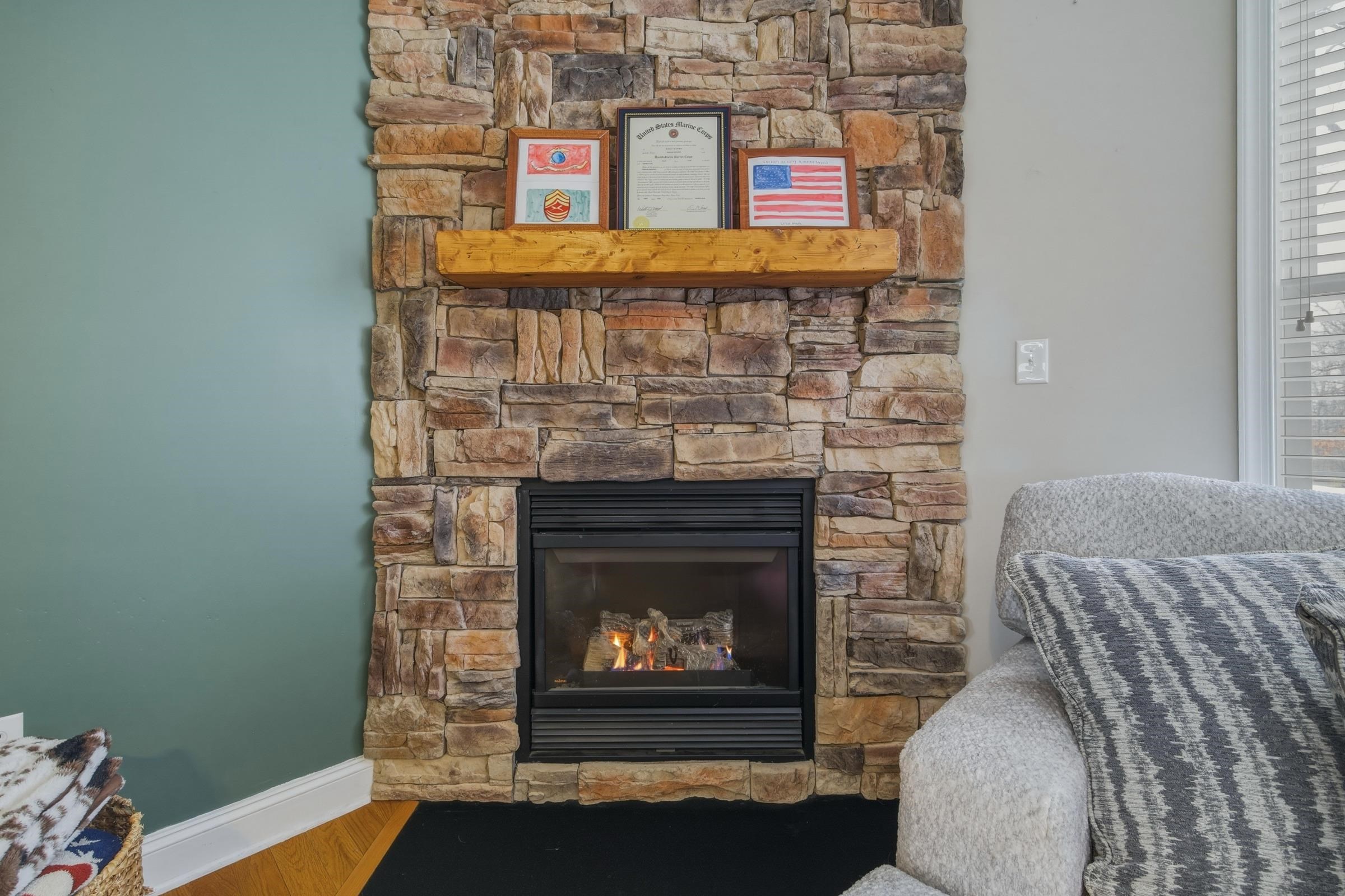 257 Hunter Road Maurertown, VA 22644 - Photo 9 of 61 a fireplace with a clock on top of it