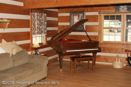 193 Elk Lake Road Meshoppen, PA 18630 - Photo 6 of 12 a room with furniture and a large window