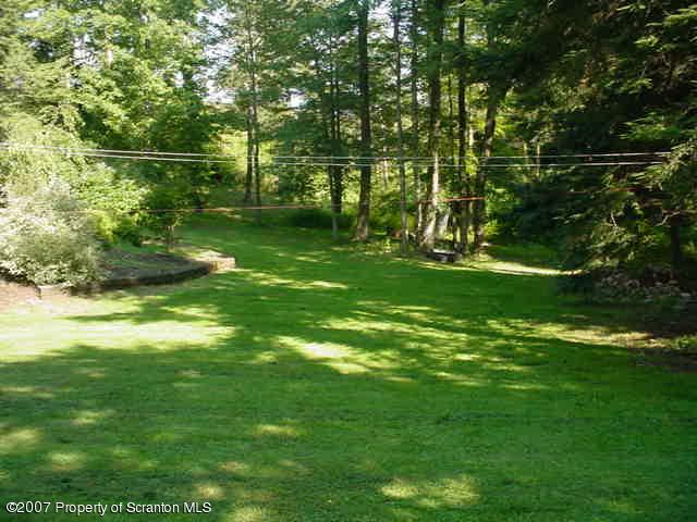 193 Elk Lake Road Meshoppen, PA 18630 - Photo 9 of 12 a backyard of a house with lots of green space