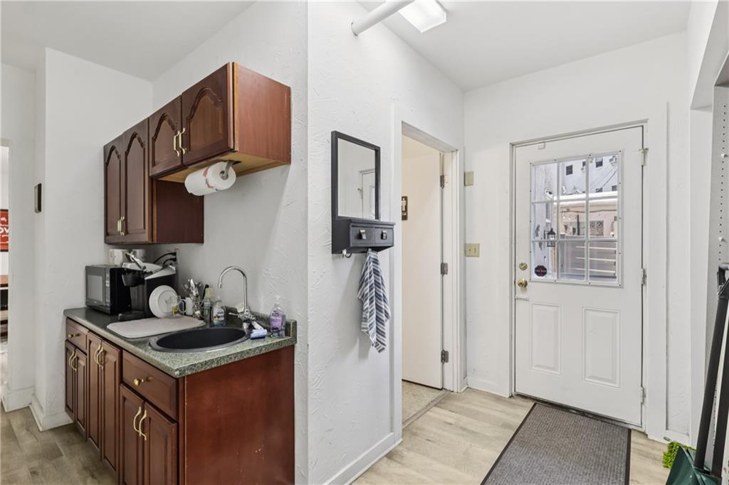 4723 Butler Street Pittsburgh, PA 15201 - Photo 12 of 47 a kitchen with stainless steel appliances granite countertop a stove and a refrigerator