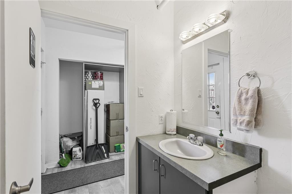 4723 Butler Street Pittsburgh, PA 15201 - Photo 14 of 47 a bathroom with a sink and a mirror