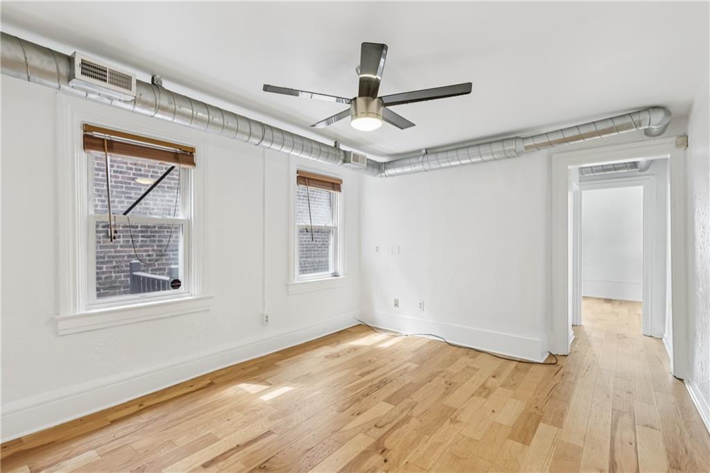 4723 Butler Street Pittsburgh, PA 15201 - Photo 25 of 47 a view of empty room with wooden floor and fan