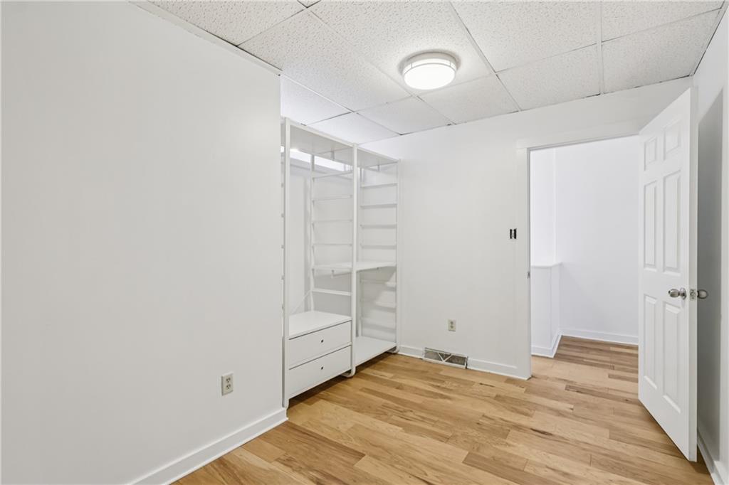 4723 Butler Street Pittsburgh, PA 15201 - Photo 35 of 47 a view of empty room with wooden floor
