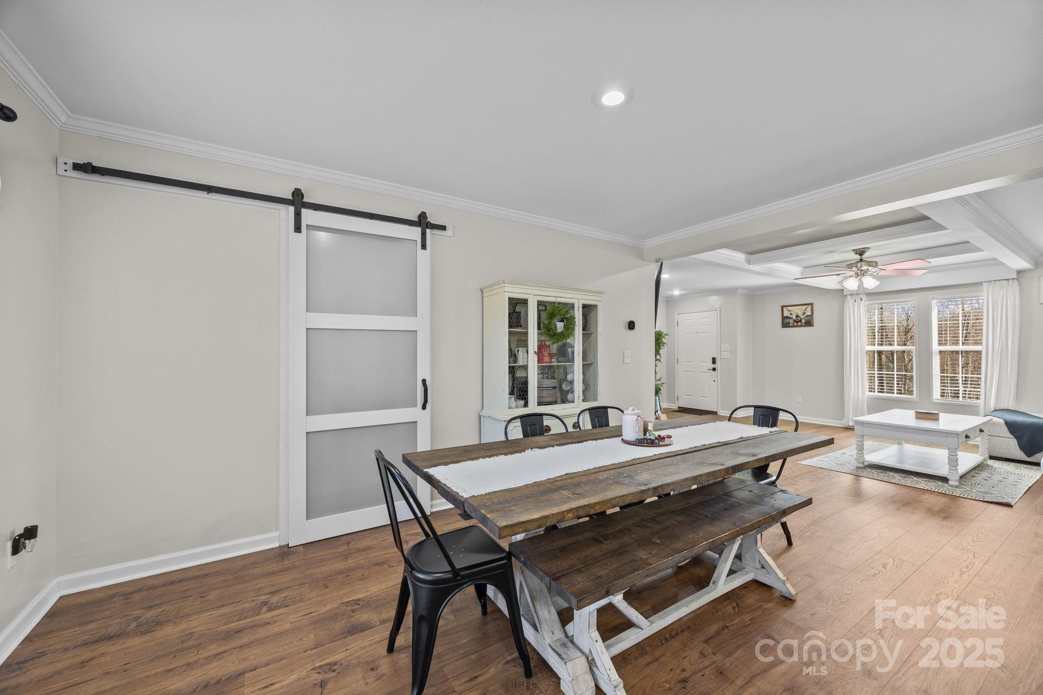 247 Aden Green Road Mill Spring, NC 28756 - Photo 14 of 48 a view of a dining room with furniture and wooden floor