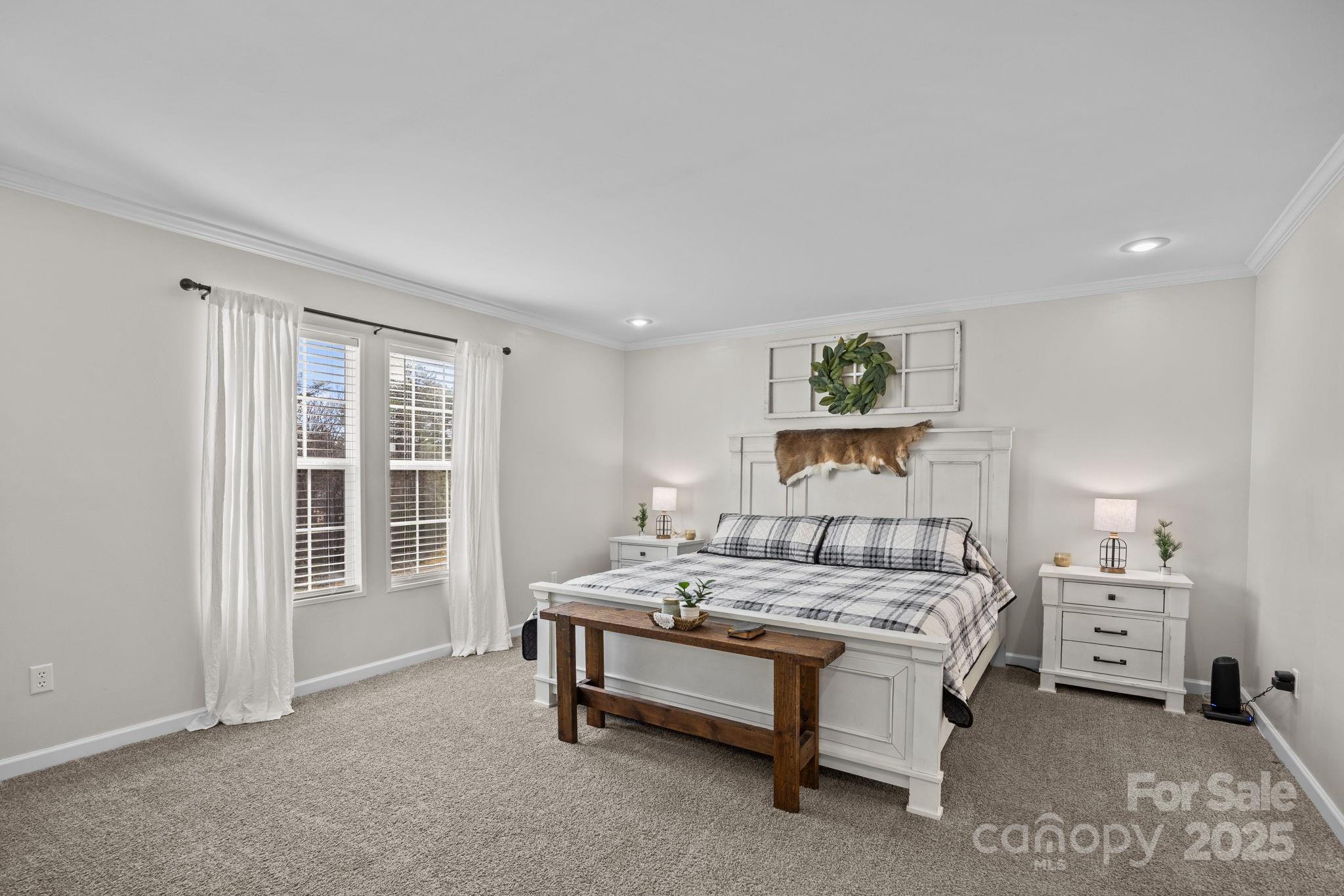 247 Aden Green Road Mill Spring, NC 28756 - Photo 21 of 48 a bedroom with a bed and a window