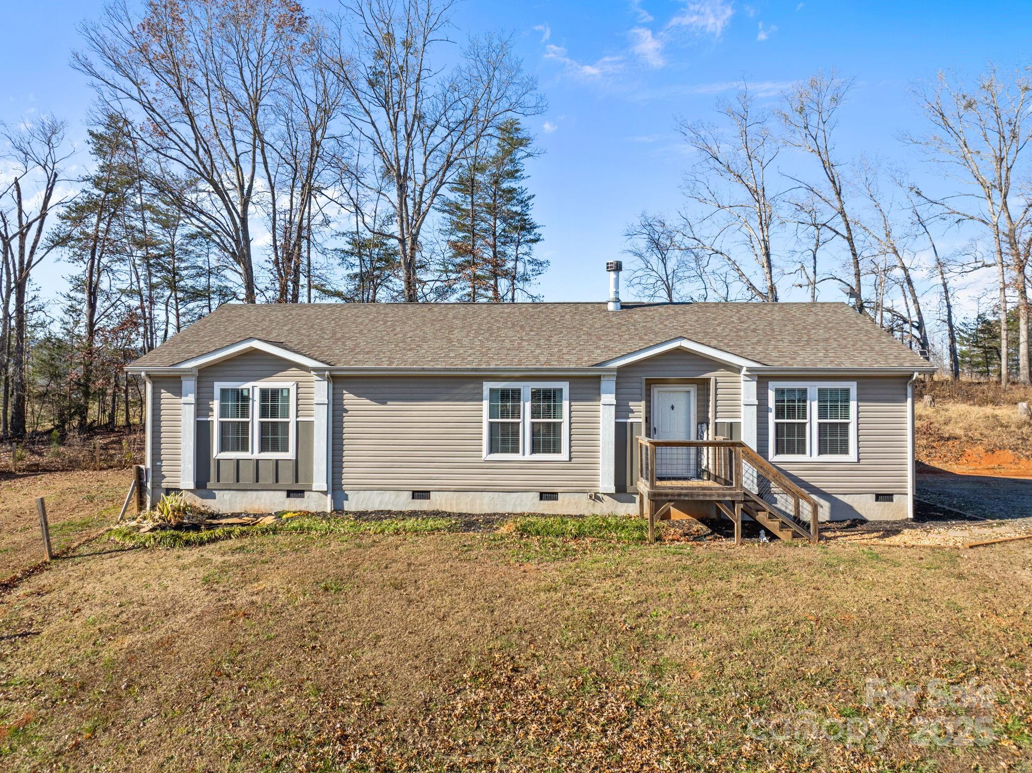247 Aden Green Road Mill Spring, NC 28756 - Photo 34 of 48 a front view of a house with yard