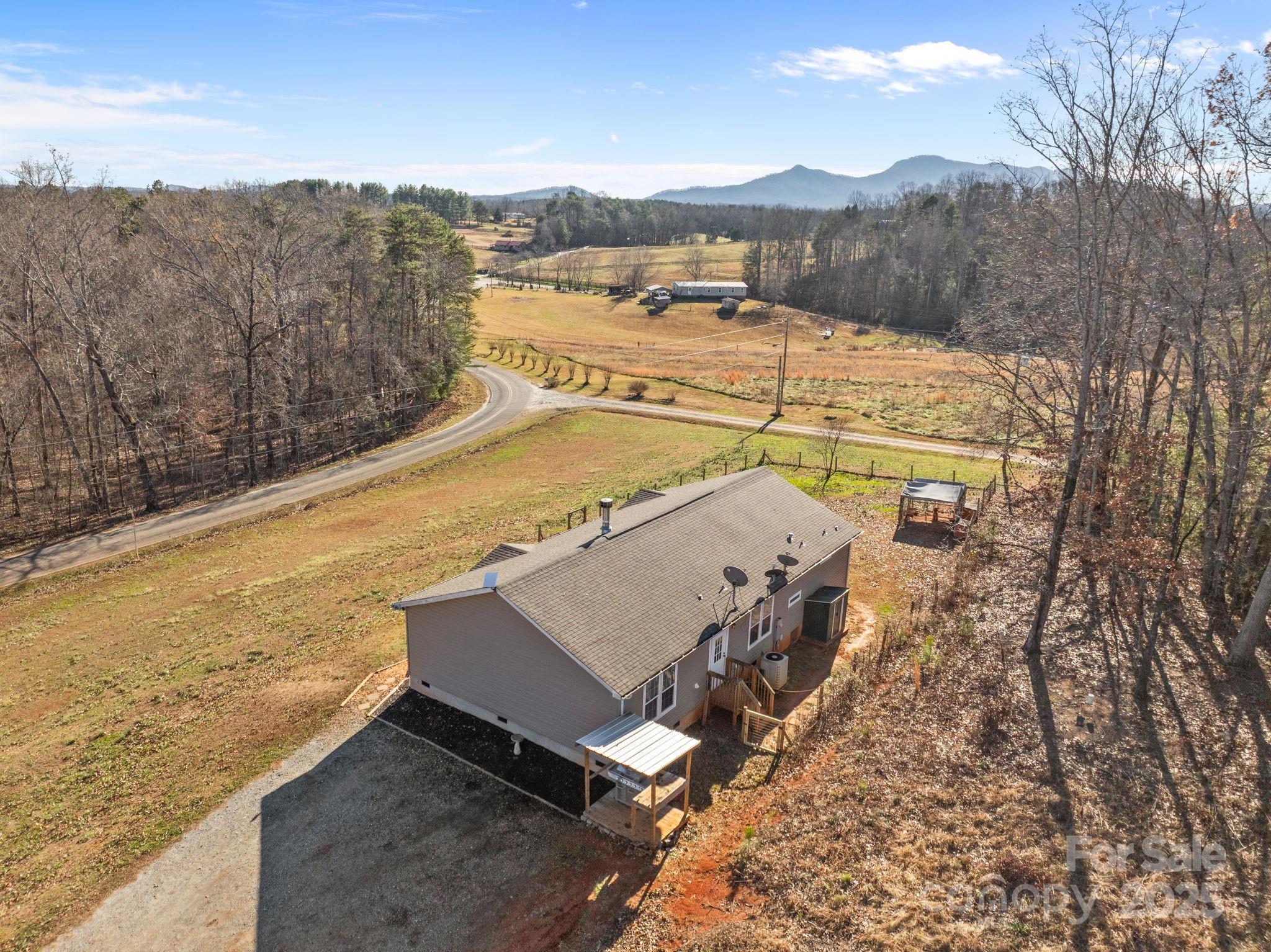 247 Aden Green Road Mill Spring, NC 28756 - Photo 37 of 48 a view of a terrace with skyline