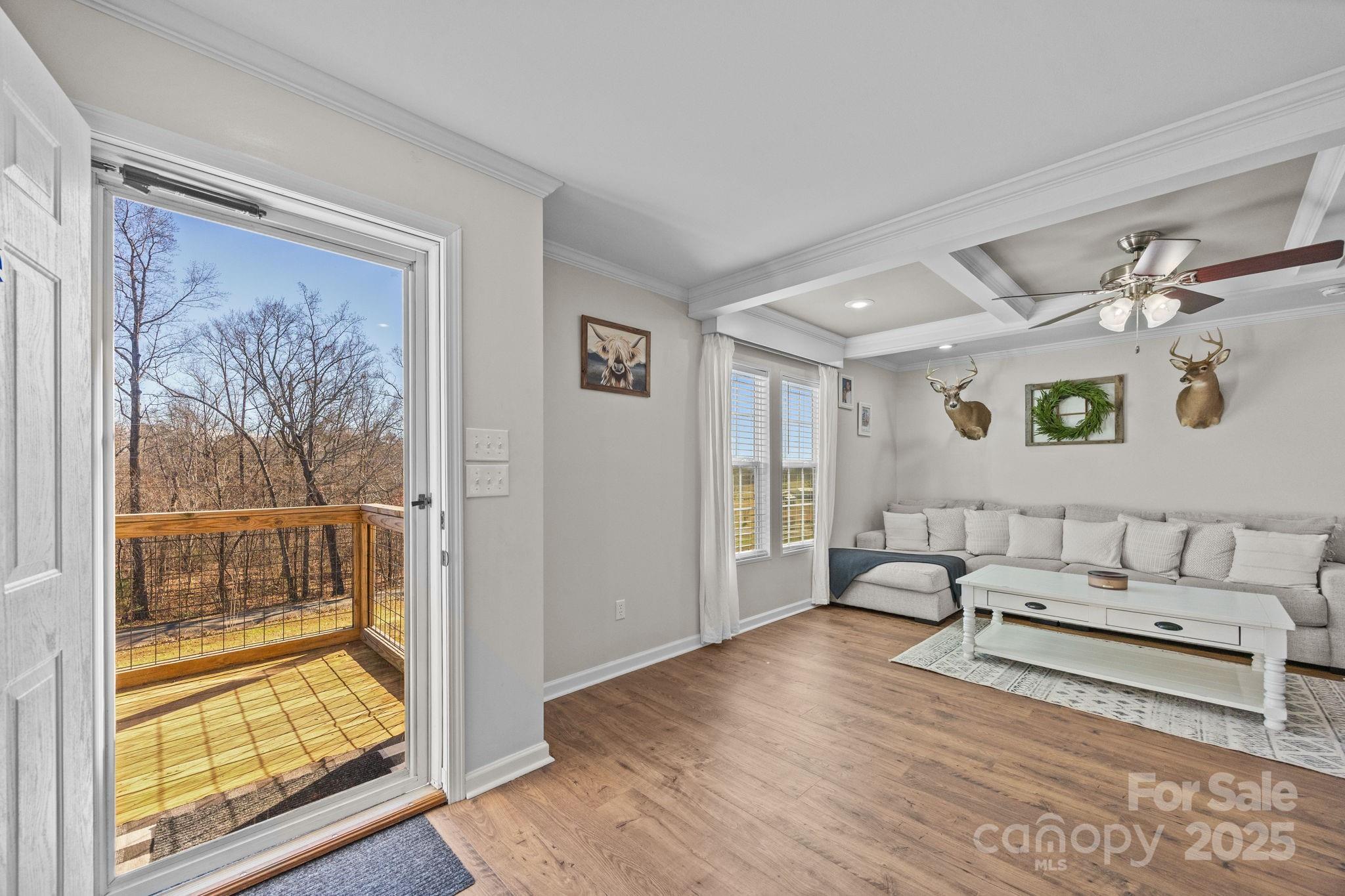 247 Aden Green Road Mill Spring, NC 28756 - Photo 5 of 48 a living room with furniture and wooden floor