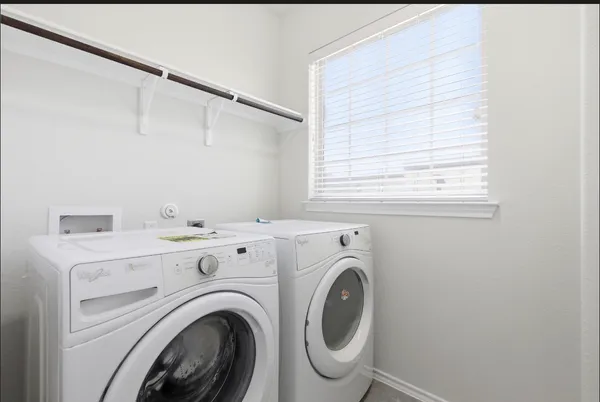 a utility room with dryer and washer