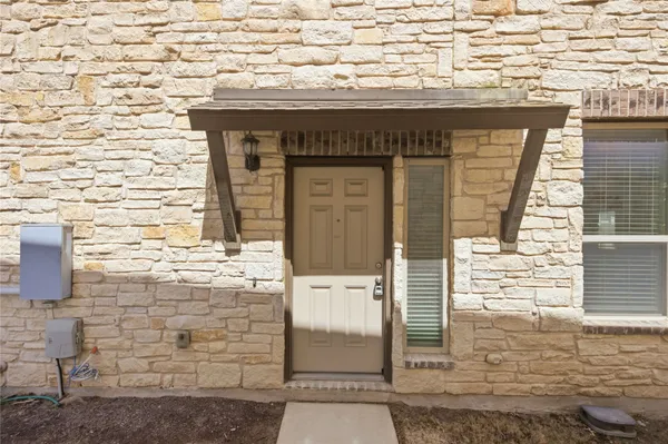 a front view of a house with an empty space