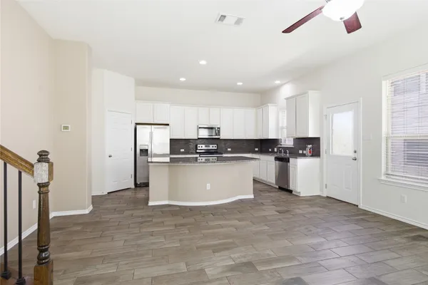 a view of kitchen with wooden floor