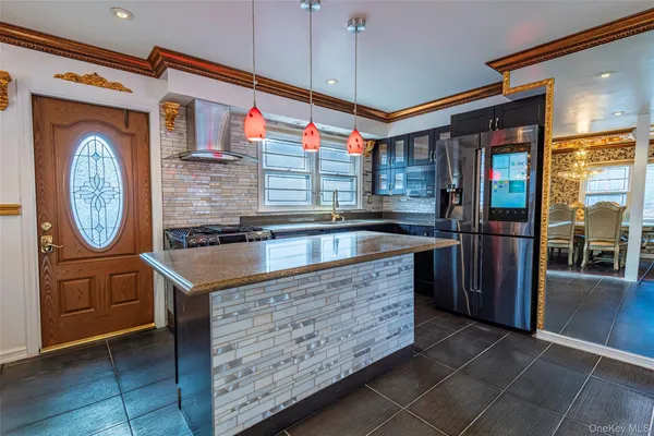 a kitchen with granite countertop a sink and a stove