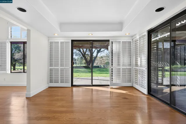 a kitchen with kitchen island granite countertop a sink stove and refrigerator