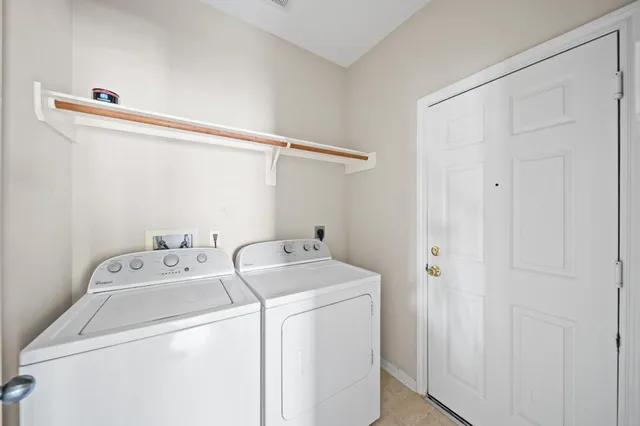 a view of a hallway with wooden floor and entryway