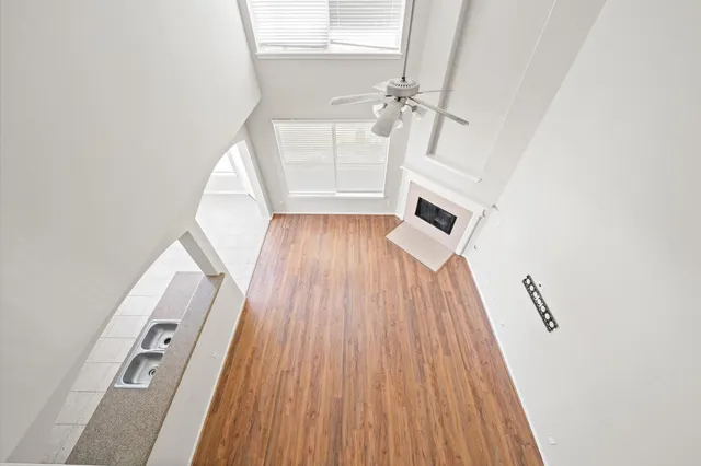 a spacious bathroom with a granite countertop sink and a mirror