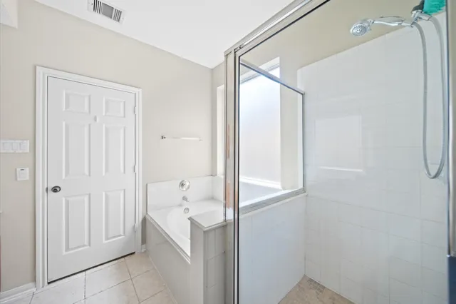 a view of a hallway with wooden floor and entryway