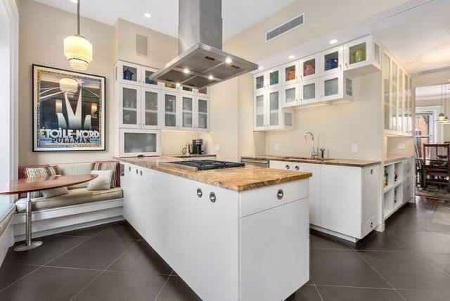a living room with a couch next to a window