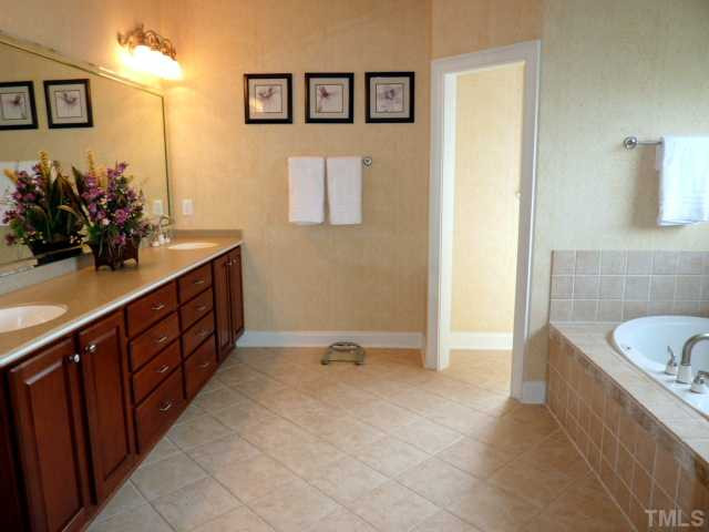 12301 Bunchgrass Lane Raleigh, NC 27614 - Photo 8 of 19 Simply Elegant! The Master Spa is adorned with gorgeous Tile and a nicely sized double Vanity. The private water closet is also a great feature. Master Bath/Spa