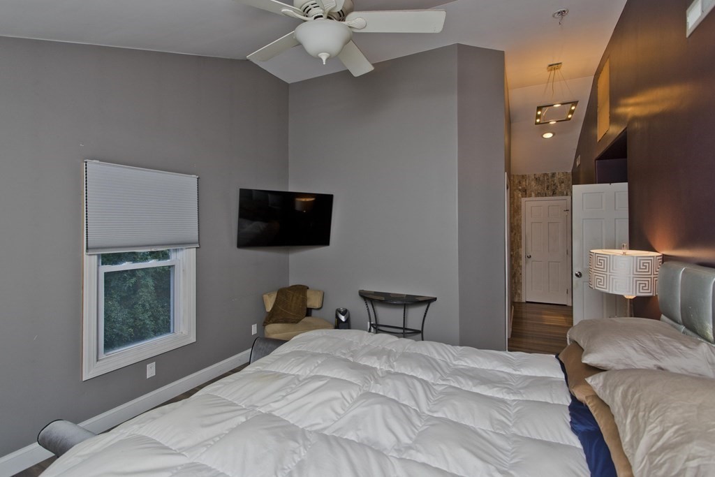 98 Greenwich Road Ware, MA 01082 - Photo 13 of 22 a bedroom with a bed and wooden floor