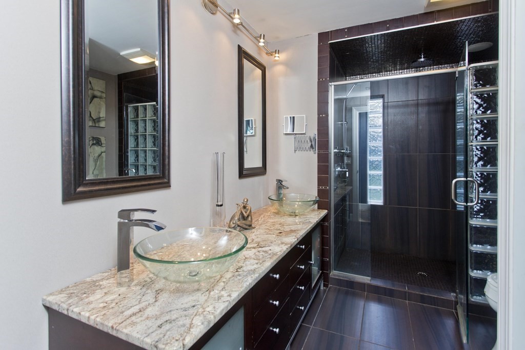 98 Greenwich Road Ware, MA 01082 - Photo 9 of 22 a bathroom with a granite countertop sink a mirror and shower