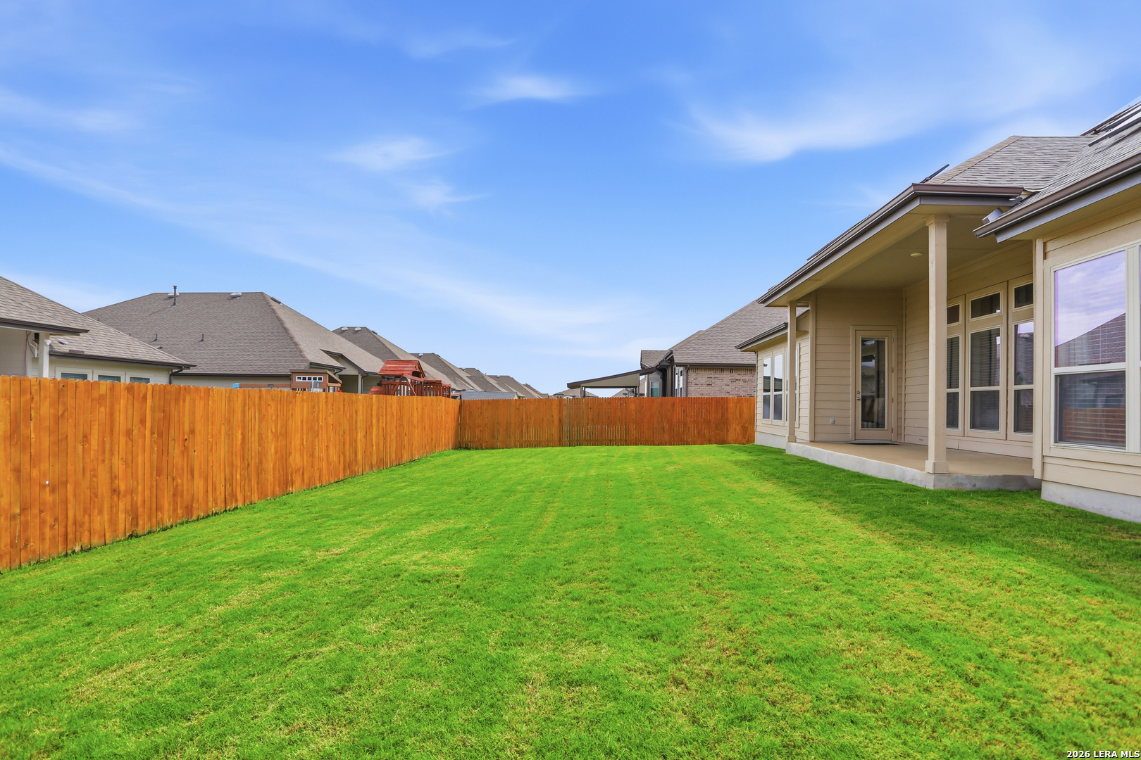 337 Misty Sails Cibolo, TX 78108 - Photo 38 of 50 a view of backyard with a garden and deck