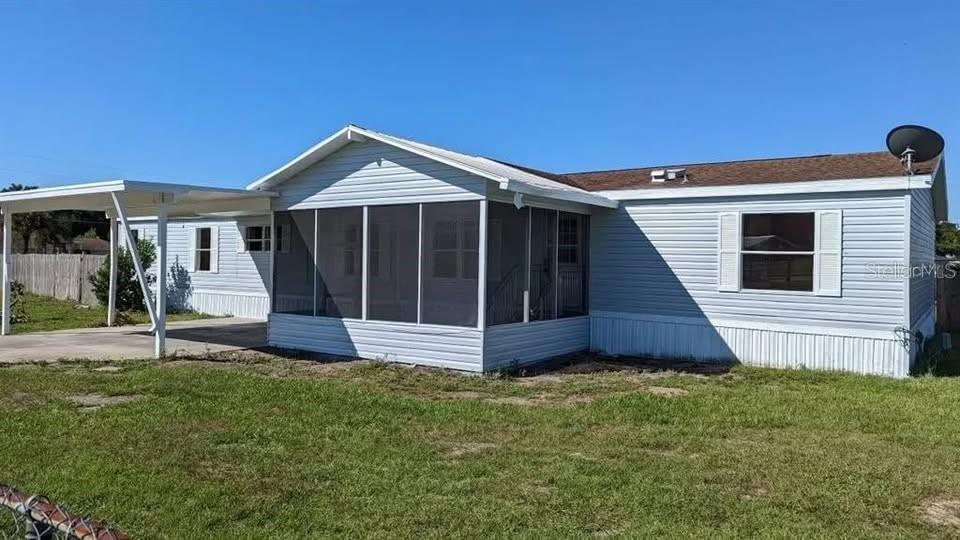 4300 Meadow Ridge Avenue Mulberry, FL 33860 - Photo 1 of 25 a view of a house with a yard and porch