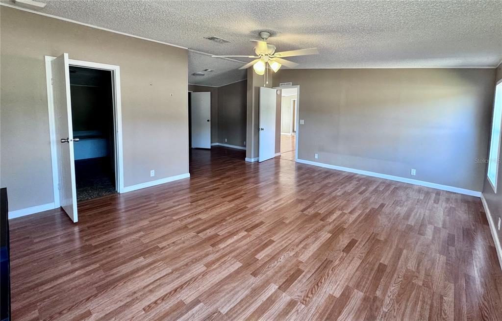 4300 Meadow Ridge Avenue Mulberry, FL 33860 - Photo 12 of 25 wooden floor in an empty room with a window