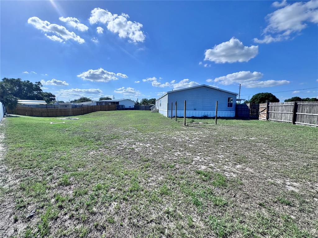 4300 Meadow Ridge Avenue Mulberry, FL 33860 - Photo 25 of 25 a view of a house with a big yard