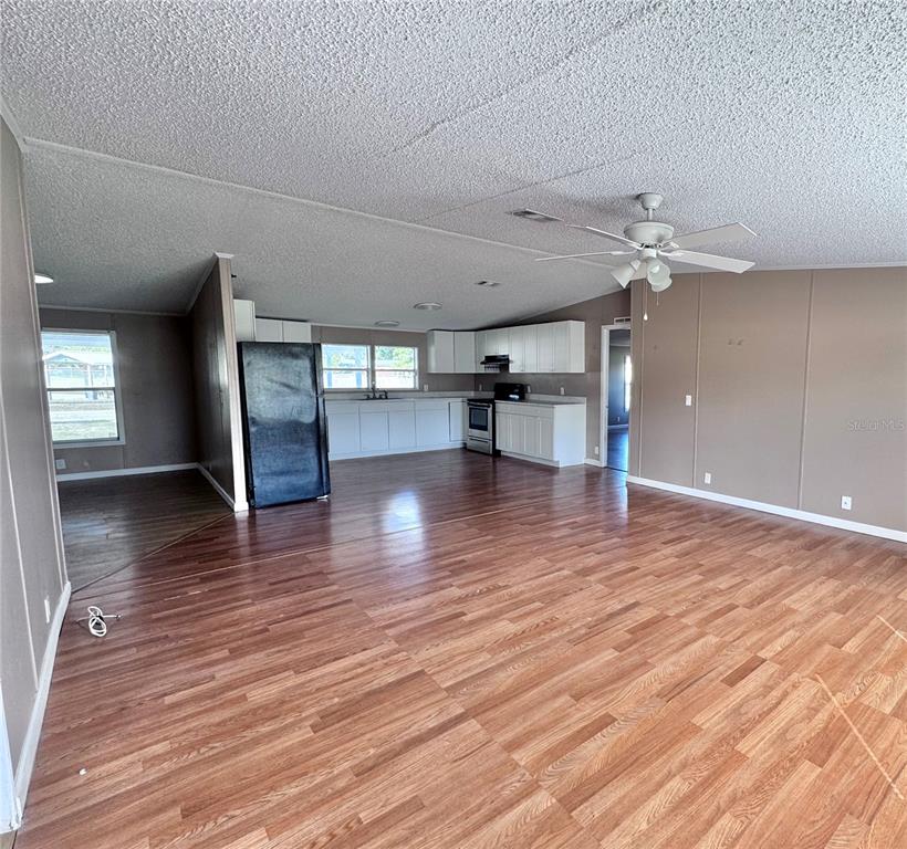 4300 Meadow Ridge Avenue Mulberry, FL 33860 - Photo 6 of 25 a view of empty room with wooden floor