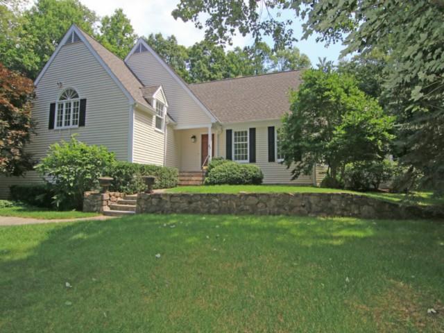 48 Marvin Ridge Place Wilton, CT 06897 - Photo 1 of 1 a front view of house with yard and green space
