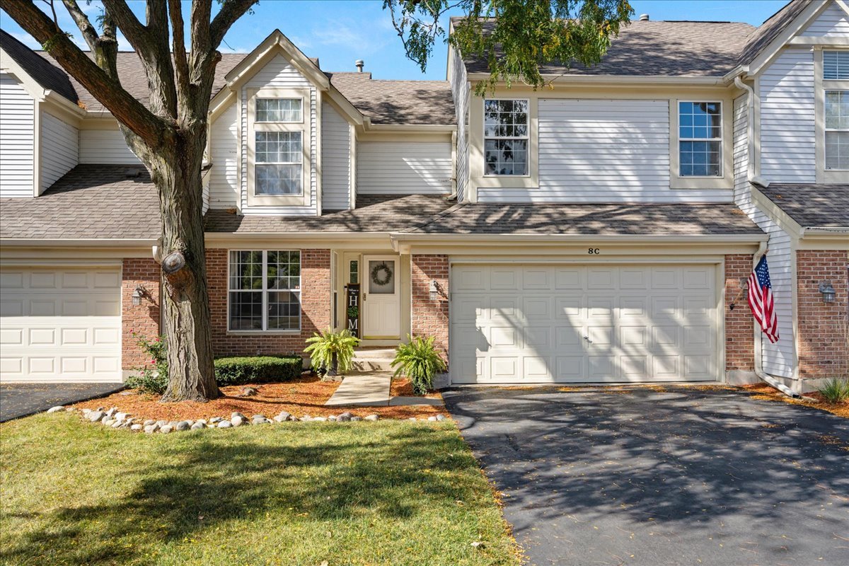 8 Ione Drive, Unit C South Elgin, IL 60177 - Photo 1 of 31 a front view of a house with a yard