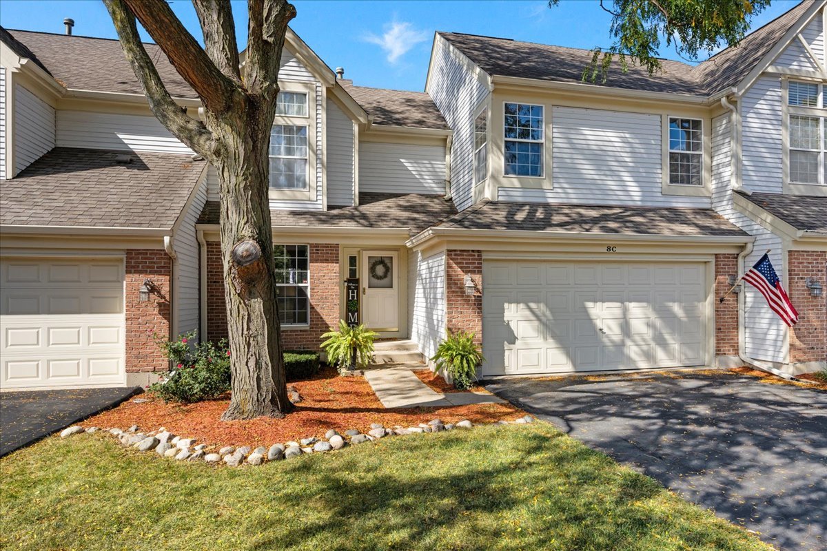 8 Ione Drive, Unit C South Elgin, IL 60177 - Photo 2 of 31 a front view of a house with a yard