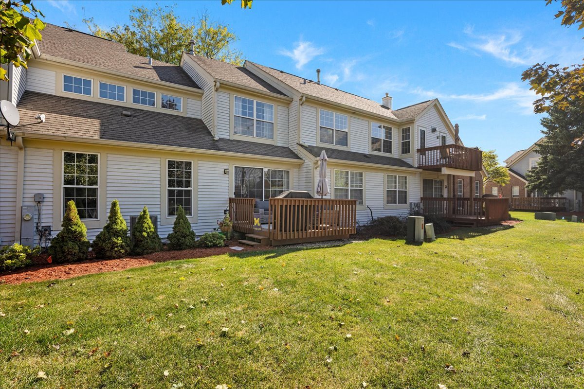 8 Ione Drive, Unit C South Elgin, IL 60177 - Photo 25 of 31 a view of a house with a yard and sitting area