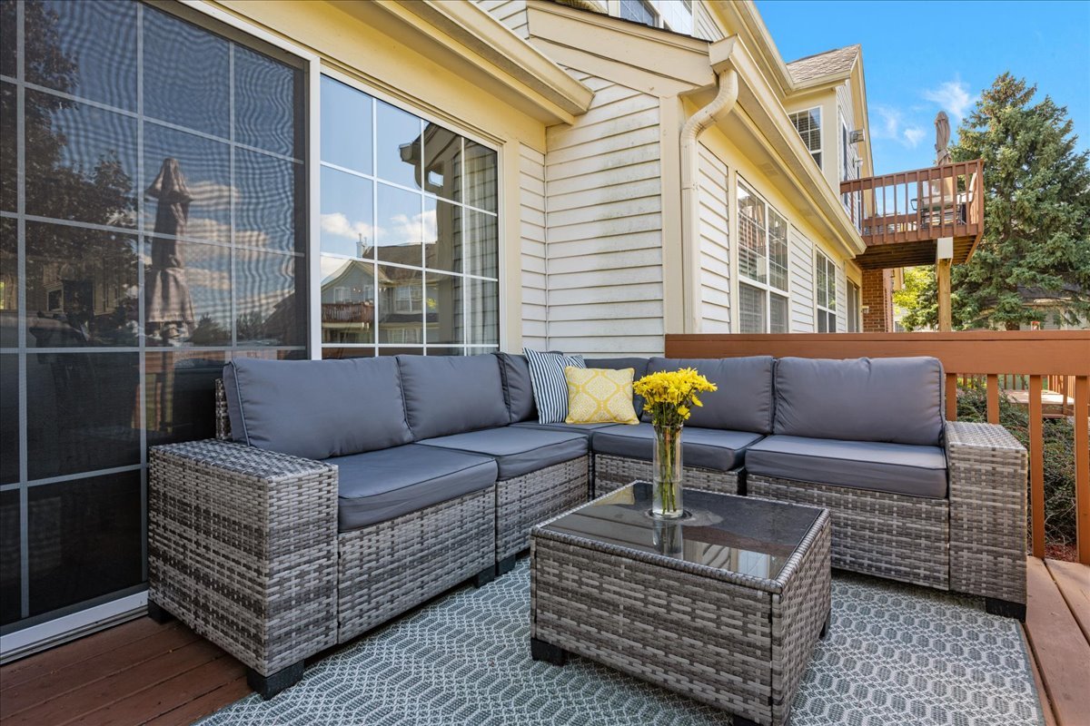 8 Ione Drive, Unit C South Elgin, IL 60177 - Photo 27 of 31 a view of a patio with couches and a potted plant on a table