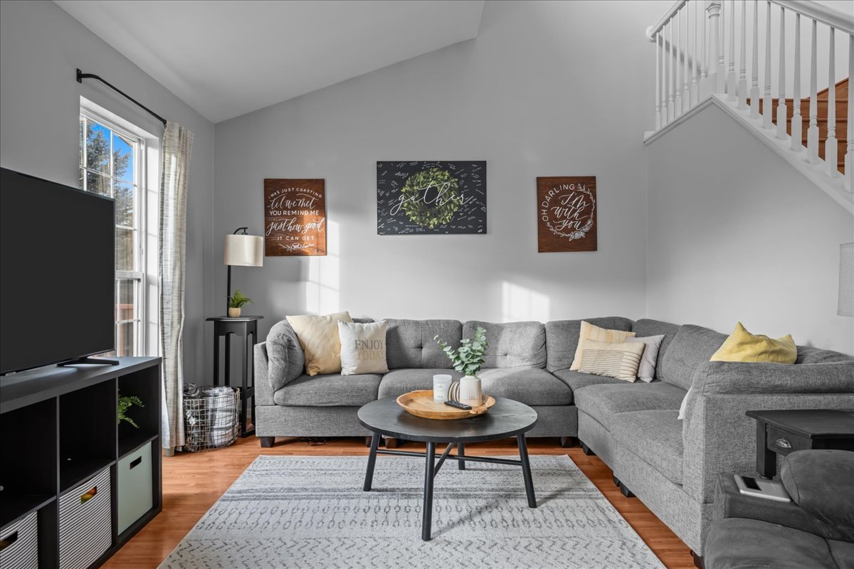 8 Ione Drive, Unit C South Elgin, IL 60177 - Photo 5 of 31 a living room with furniture and a flat screen tv