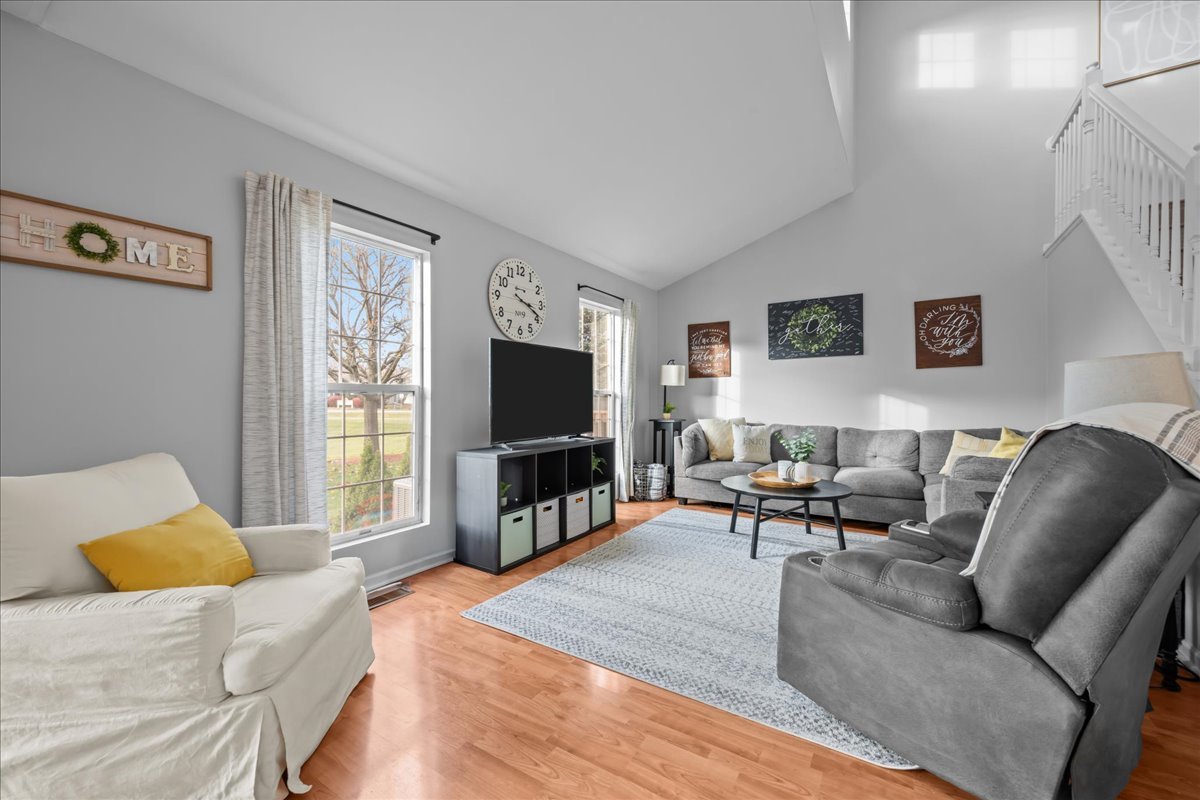 8 Ione Drive, Unit C South Elgin, IL 60177 - Photo 6 of 31 a living room with furniture and a flat screen tv